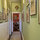 hallway with vintage Japanese art leading to living parlor