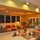 The Entertainment Room adjoins the kitchen, where news and movies are viewed on the 54 inch TV.