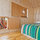 The Cabin's windows look out into the living area and the treehouse loft