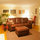 Part of living room, at nighttime,  looking into hall and bathroom
