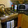 Stainless steel stove and microwave. 