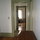 View from bedroom, through bathroom, to living room/kitchen