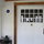 Huge front door leading from porch to the living room.