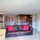 The spacious apartment lounge and four poster double bed.