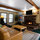 There is the fireplace!  Check out the custom pine tree paintings on the wall! Flat screen with cable tv and dvd player for entertainment! 