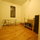 Upstairs common area with mini-fridge, workbench with tools, and extra desk