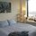 Your bedroom, complete with queen-size bed, New York artwork and spectacular views!