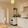 Equipped kitchen with gas stove, microwave, cooking supplies and coffee maker. 