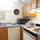 Full kitchen with dishwasher.