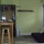 Looking from bed, view of eating area, wardrobe and couch.