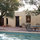 Patio set under the trees and next to the pool!