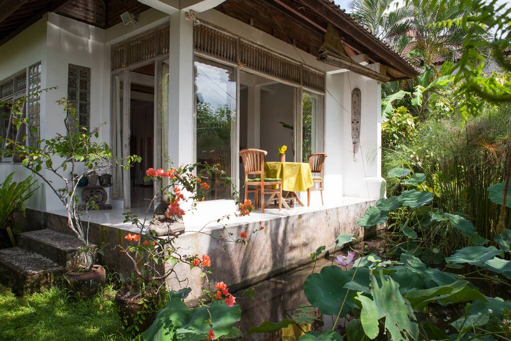 Living room opens onto a lotus pond