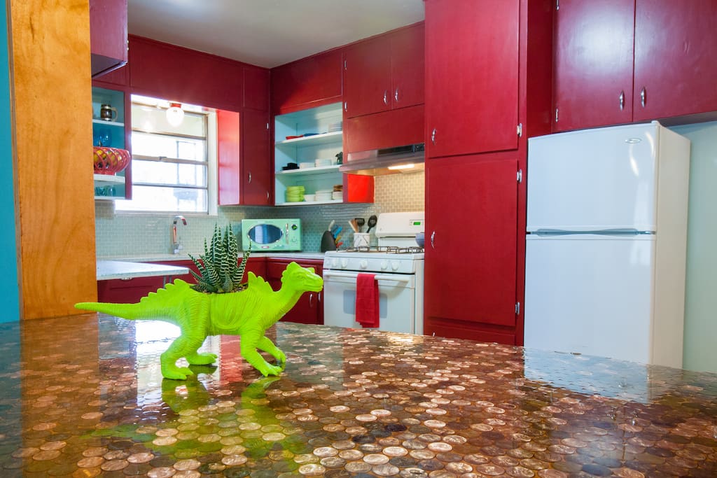 The penny tiled bar brings the living room and kitchen together. It cost $30!