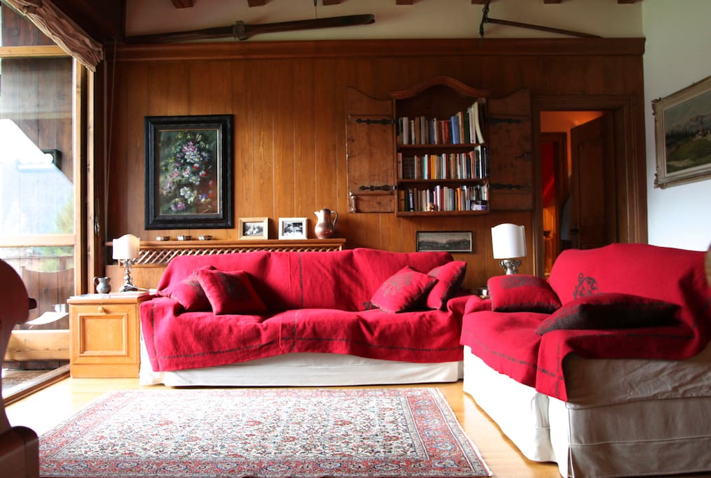 the living room - door on the right leads to the master and triple bedrooms and the main bathroom. huge french window on the left opens completely on the balcony