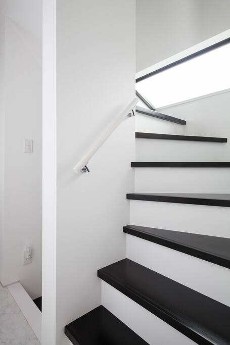 There are internal stairs with hand rails for the three floors