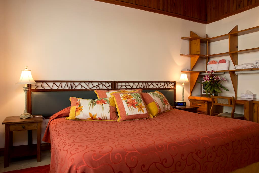 Standard room with king bed, desk & chair, large closet, tv, ceiling fan, room safe, alarm clock, & bathrobes