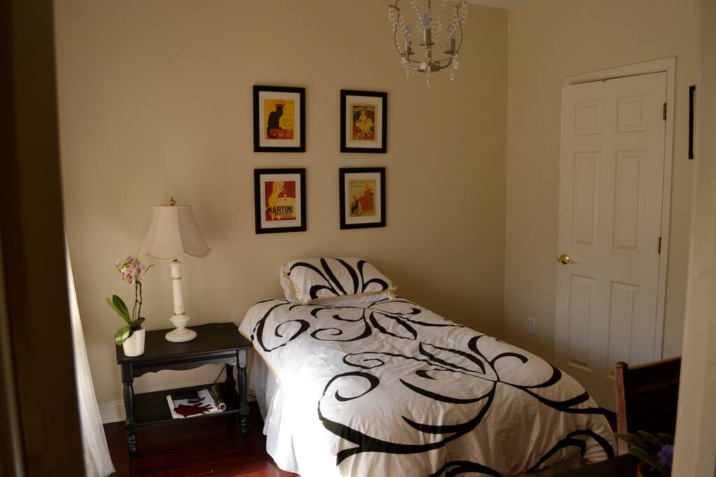Single occupancy ensuite bath (door closed) at right