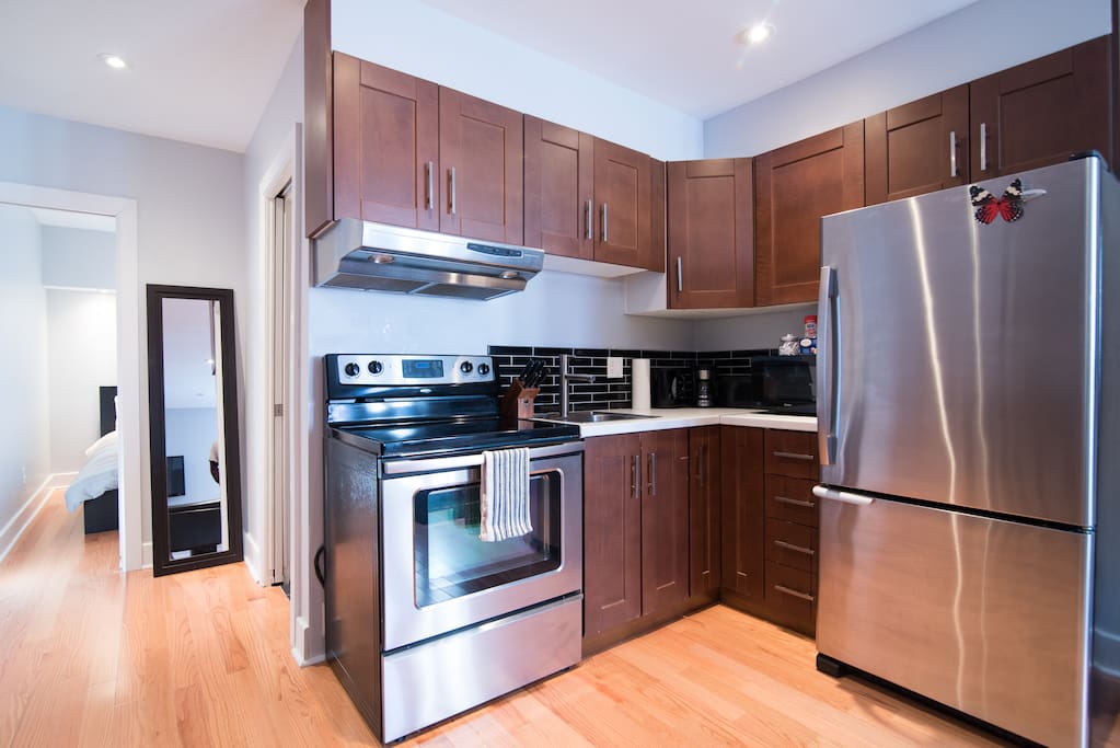 Modern Kitchen with glass tile back splash.