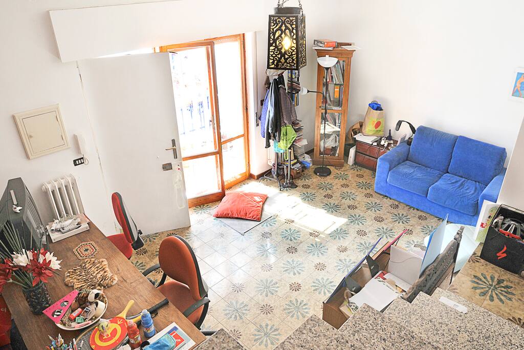 The main living room, with Argo's cushion by the window and front door
