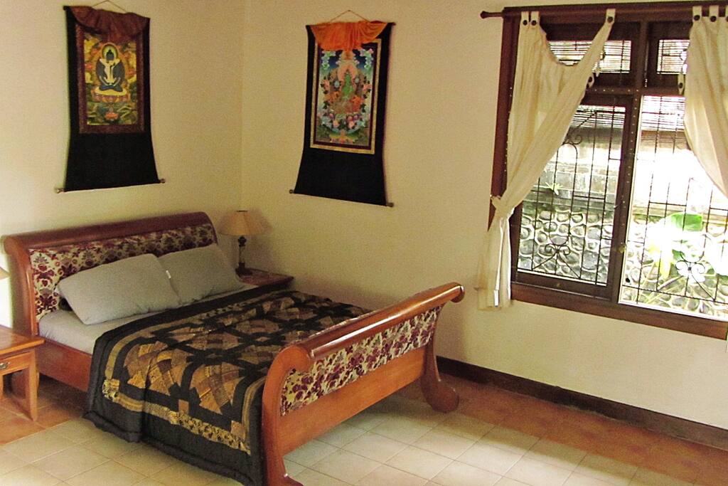 Comfy Queen size bed for sleeping surrounded by the protection of the Tibetan sacred art.